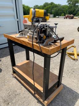 DEWALT MITER SAW ON TABLE 12" BLADES, CASTERS ON TABLE GOOD WORKING CONDITION...
