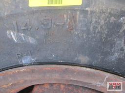 Rear tractor tire 14.9-26 on rim