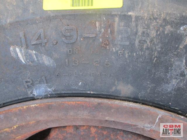 Rear tractor tire 14.9-26 on rim
