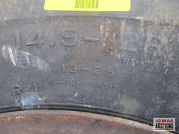 Rear tractor tire 14.9-26 on rim