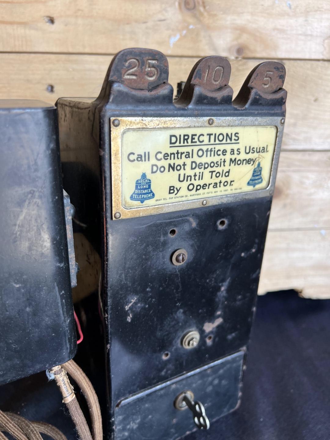 unusual Gray Paystation coin collector attached to a Kellogg Spacesaver telephone