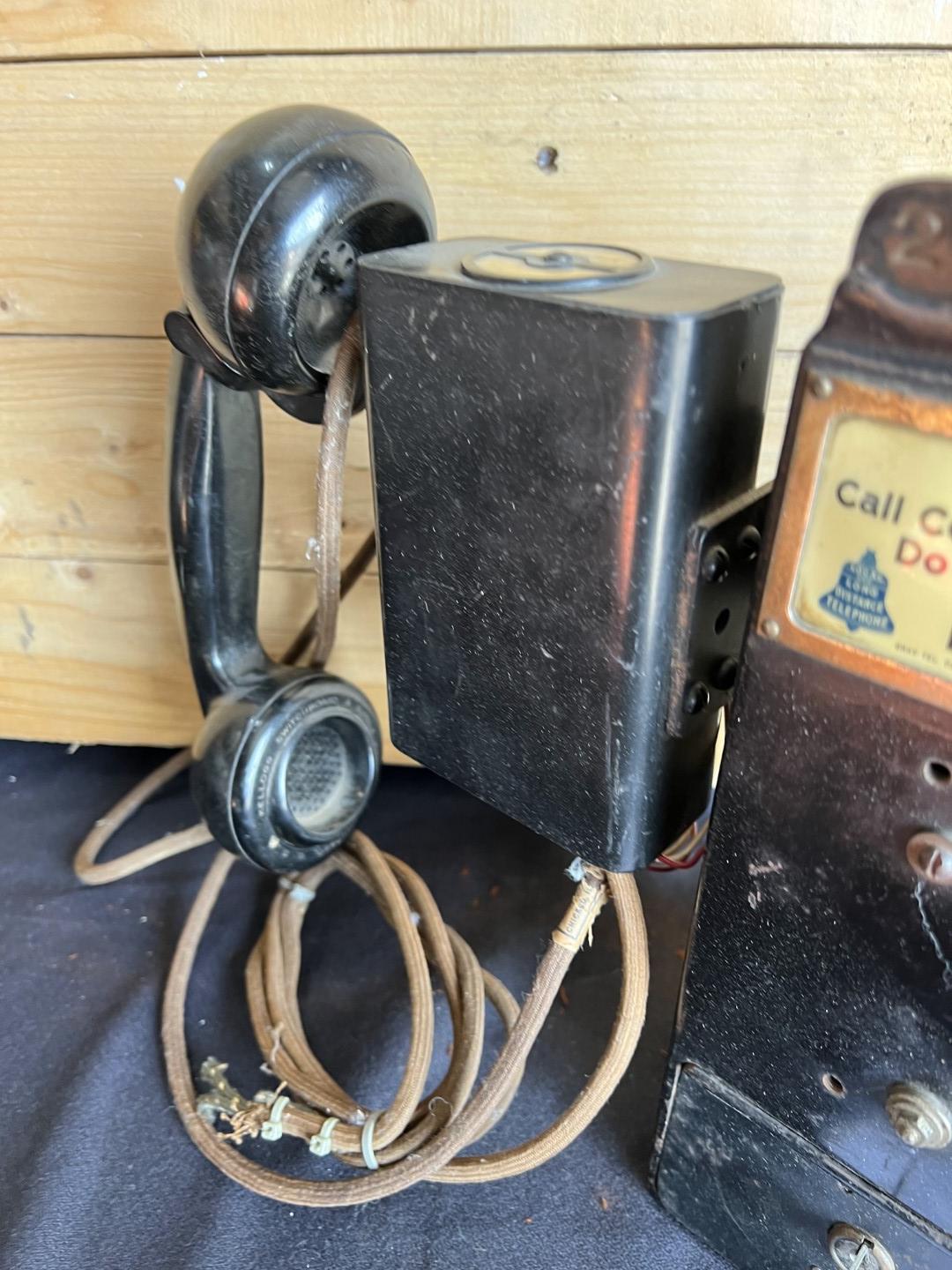 unusual Gray Paystation coin collector attached to a Kellogg Spacesaver telephone