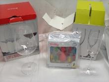 2 small wine glasses 2 large wine glasses bottle stoppers and charms