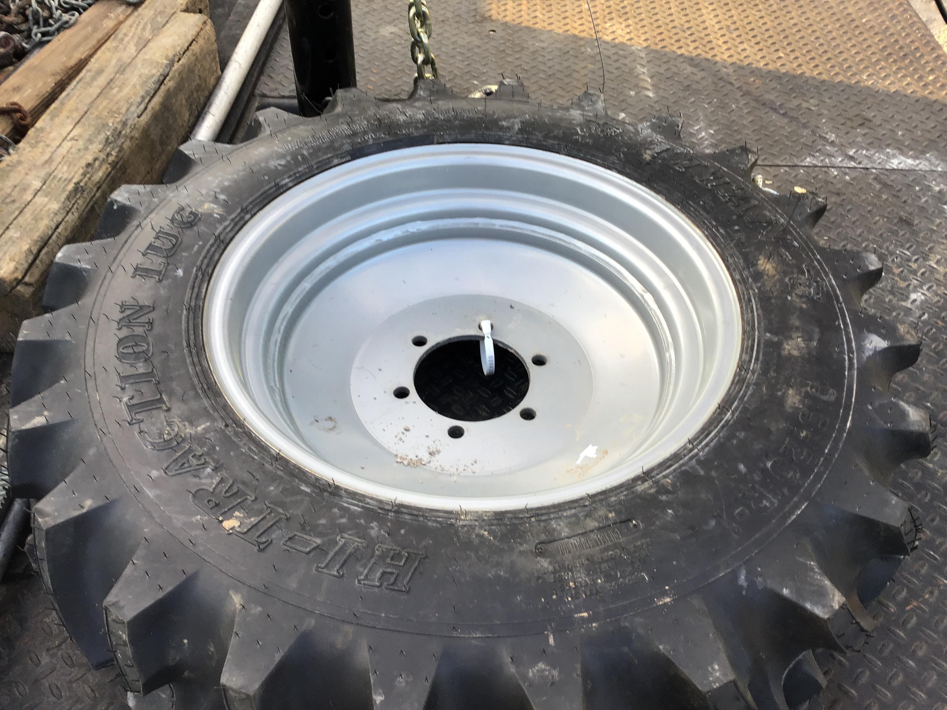 (2) NEW 9.5-20 TITAN TRACTOR TIRES AND RIMS - BOTH FOR ONE PRICE