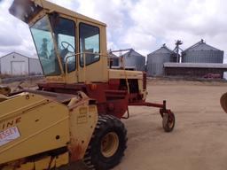 NEW HOLLAND 1499 SELF PROPELLED WINDROWER
