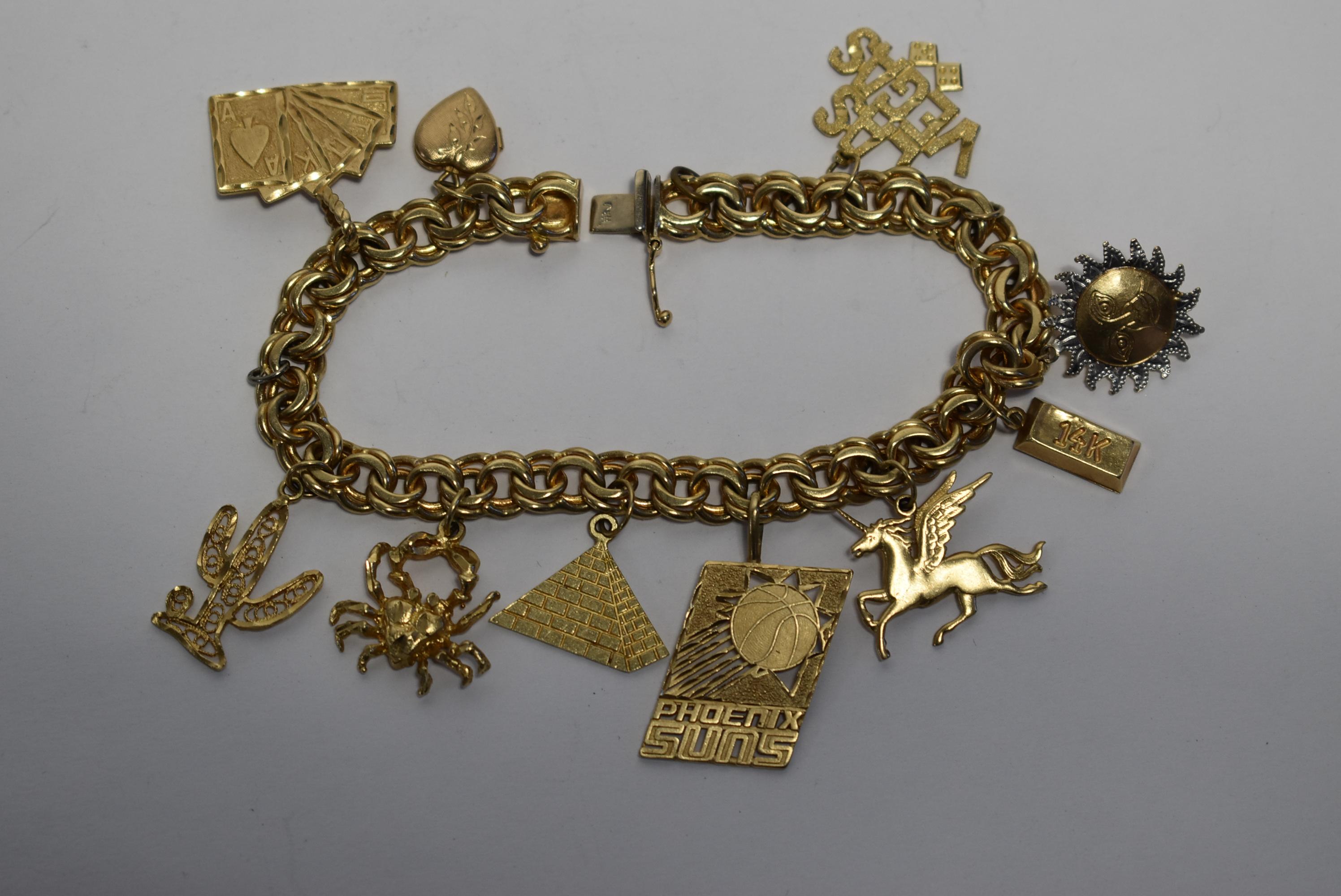 14KT GOLD CHARM BRACELET!!