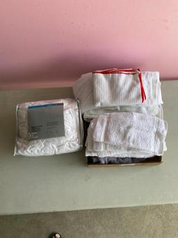Lot of wash cloths, hand towels and mattress pad
