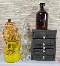 * Collection of Vintage Pharmacy Bottles and Label Cabinet