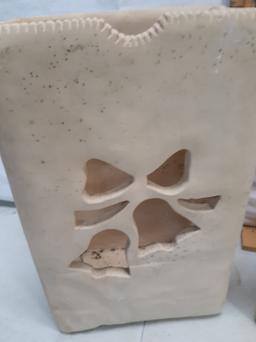 Two terra cotta candle luminaries, holiday cutout