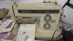 sewing machine, kenmore brand appears to work and a lot of dress patterns