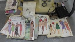 sewing machine, kenmore brand appears to work and a lot of dress patterns