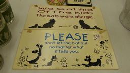 cat decor, various signs with funny sayings on them