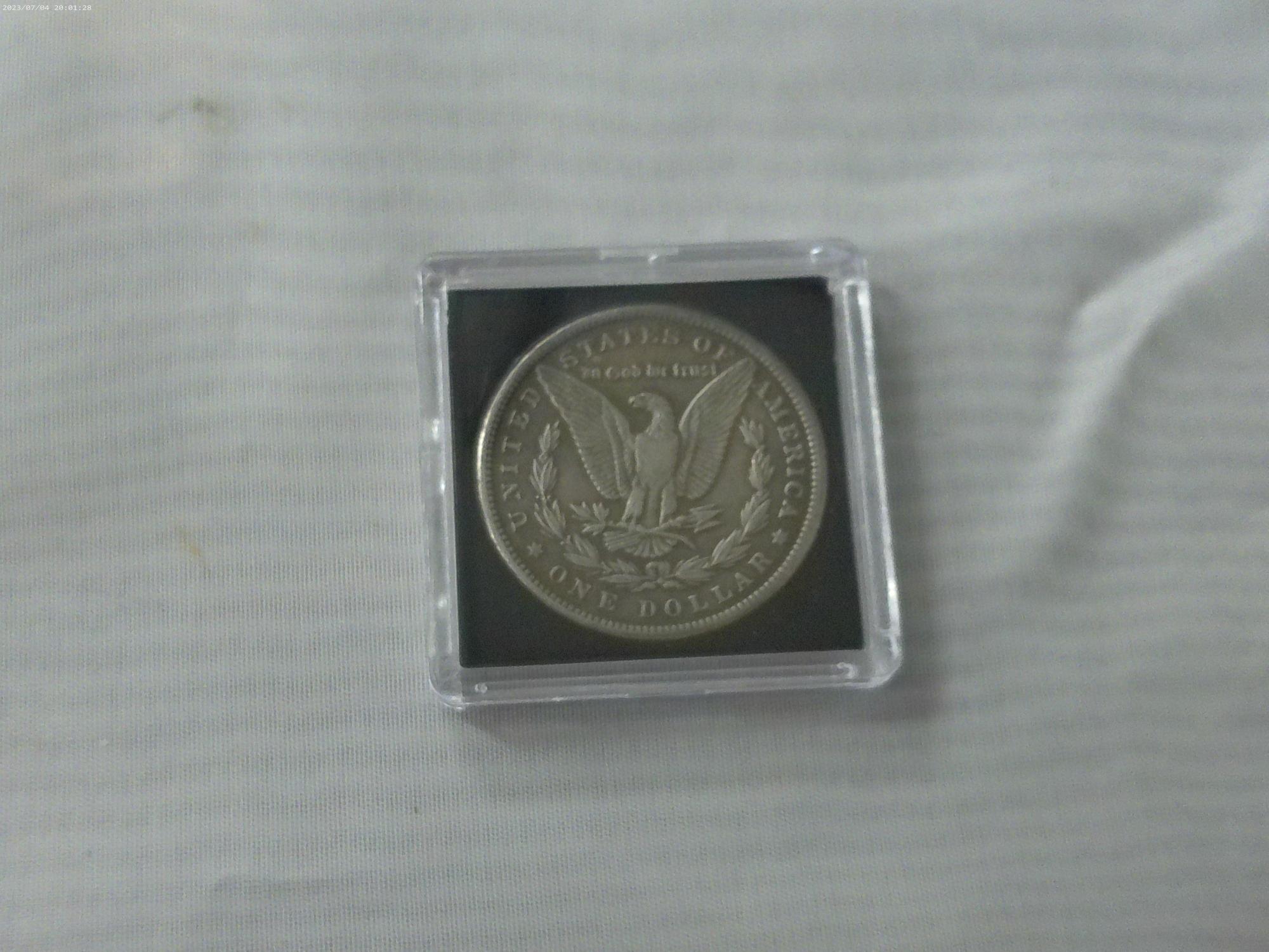 morgan dollar, 1878 P in hard case have not been porfessionally authenticated