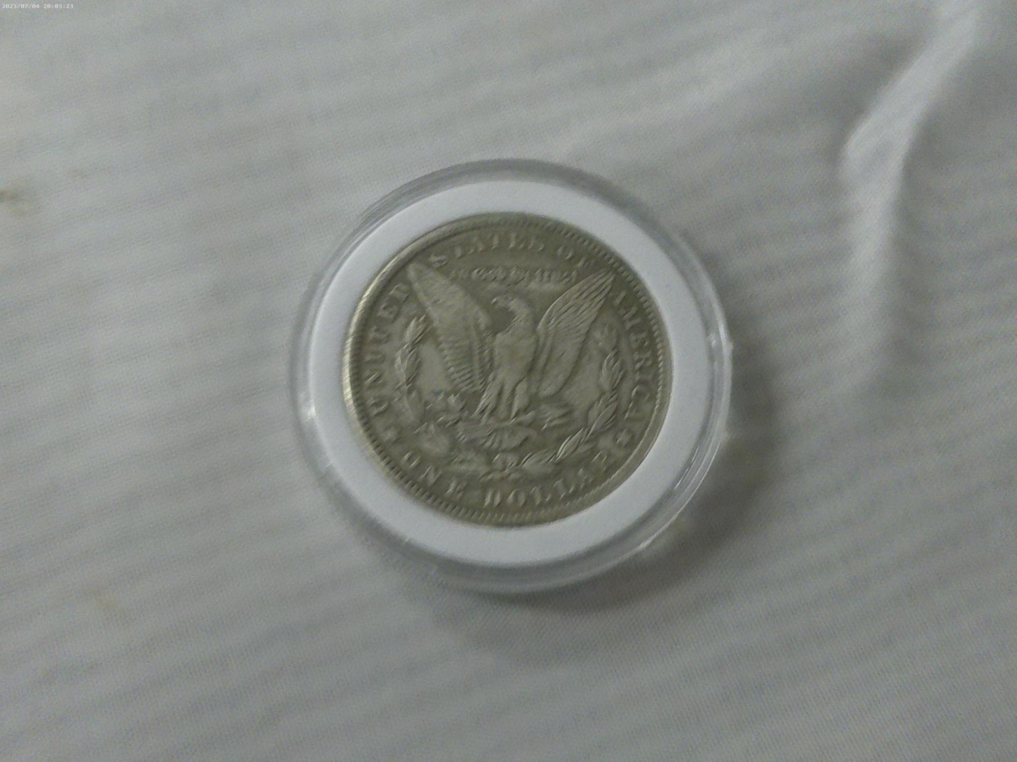 morgan dollar, 1897 P in hard case have not been porfessionally authenticated