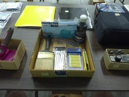 crafting lot, various paint brushes, box cutter, adhesive putty, bottle of black paint and a new pac