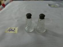 sterling and crystal salt and pepper shaker set, made in the USA both are 2.5in tall