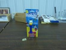 Disney pez, mickey and friends new in package Donald Duck with 3 packs of candy best by date of is 4