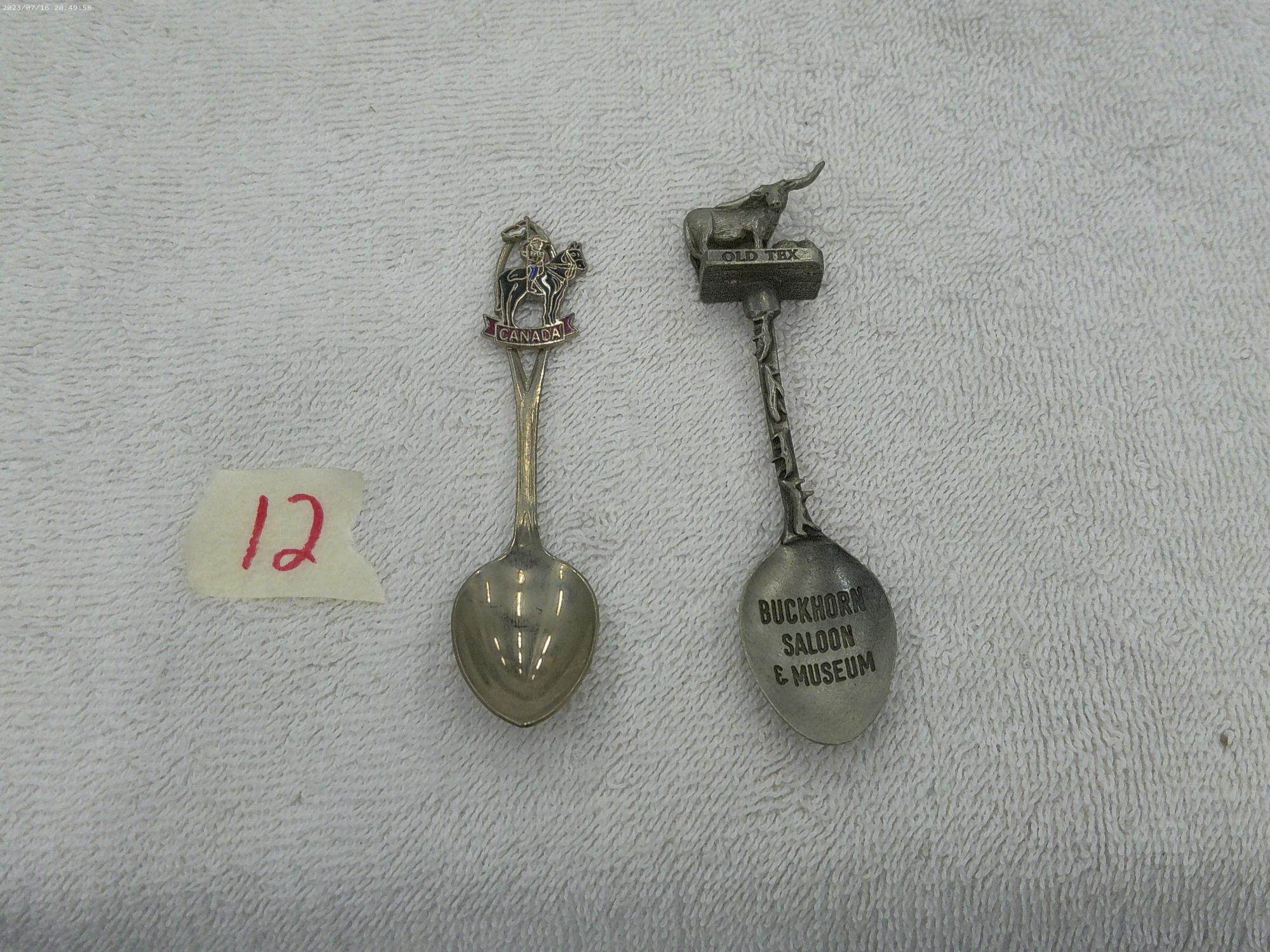 collector spoons, one from texas made in england and one from canada made in canada