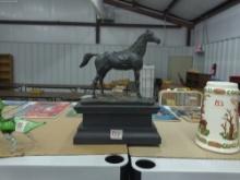 horse statue, vintage figure with repair on tail 8in wide and 11in tall
