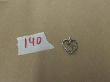 silver heart charm, marked 925 with small stones 1.4g
