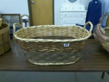 large woven basket, metal reinforced 17in long and 7in tall