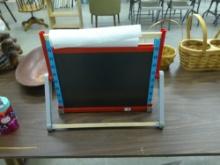 kids art easel, made by designer brand melissa & doug has 2 sides and art paper roll 18in wide and 1