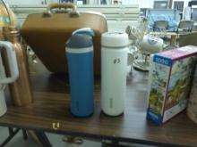 designer sports water bottles, by avana and owala both are 10in tall