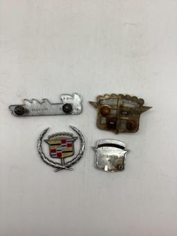 Five Cadillac Car Emblems