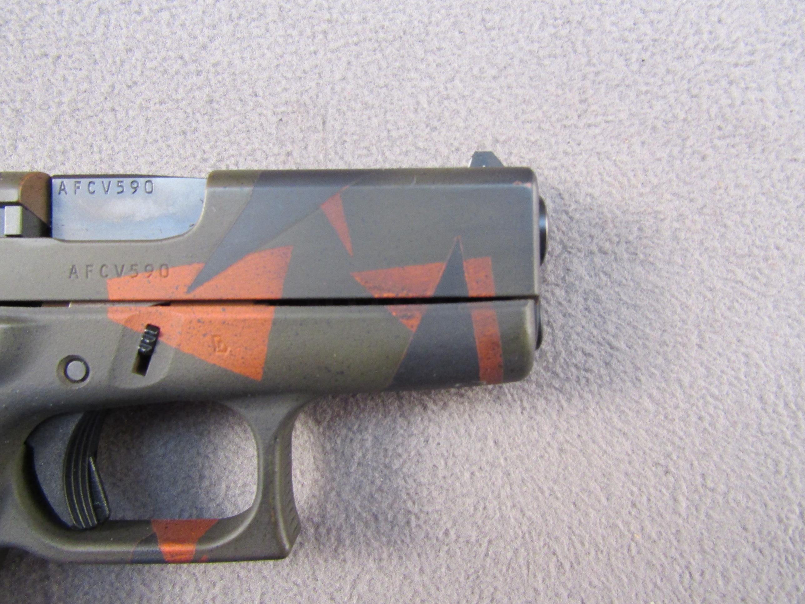handgun: GLOCK MODEL 43 CAMO, 9X19 SEMI AUTO PISTOL, S#AFCV590