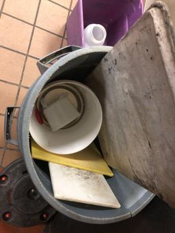 Two commercial trash cans with rolling caddy