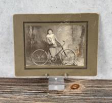 Woman with Bicycle Cabinet Photo