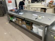 Stainless steel table 9’9” long x 34” high x 30” wide