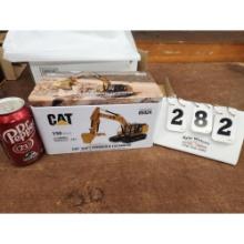 CAT 323F L Hydraulic Excavator in Collector's Tin. 1:50 Scale