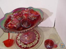 Red carnival glass punch bowl with non matching plate