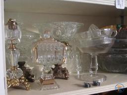 Clear glassware: covered pear dish, lighter, and other dishes