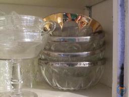 Clear glassware: covered pear dish, lighter, and other dishes