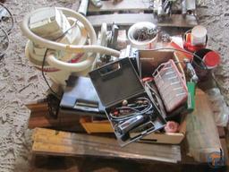Contents of pallet: wet/dry vacuum, hardware, door thresholds, extension cords, work light
