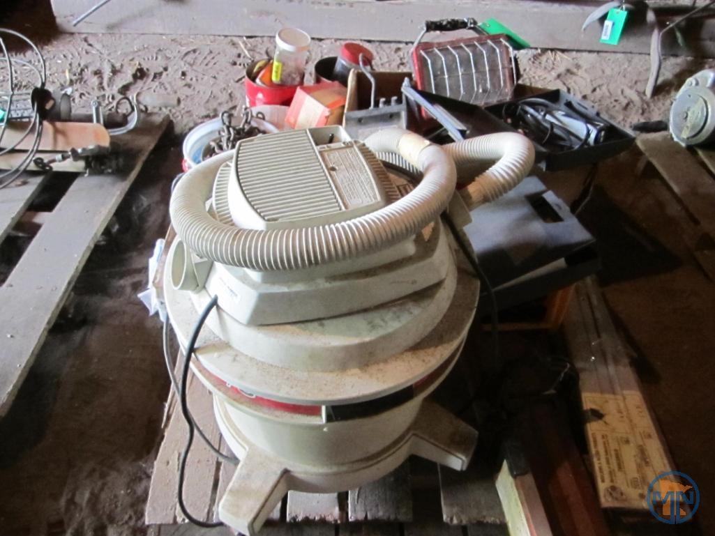 Contents of pallet: wet/dry vacuum, hardware, door thresholds, extension cords, work light