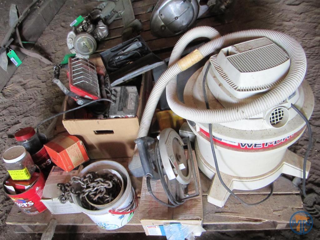 Contents of pallet: wet/dry vacuum, hardware, door thresholds, extension cords, work light