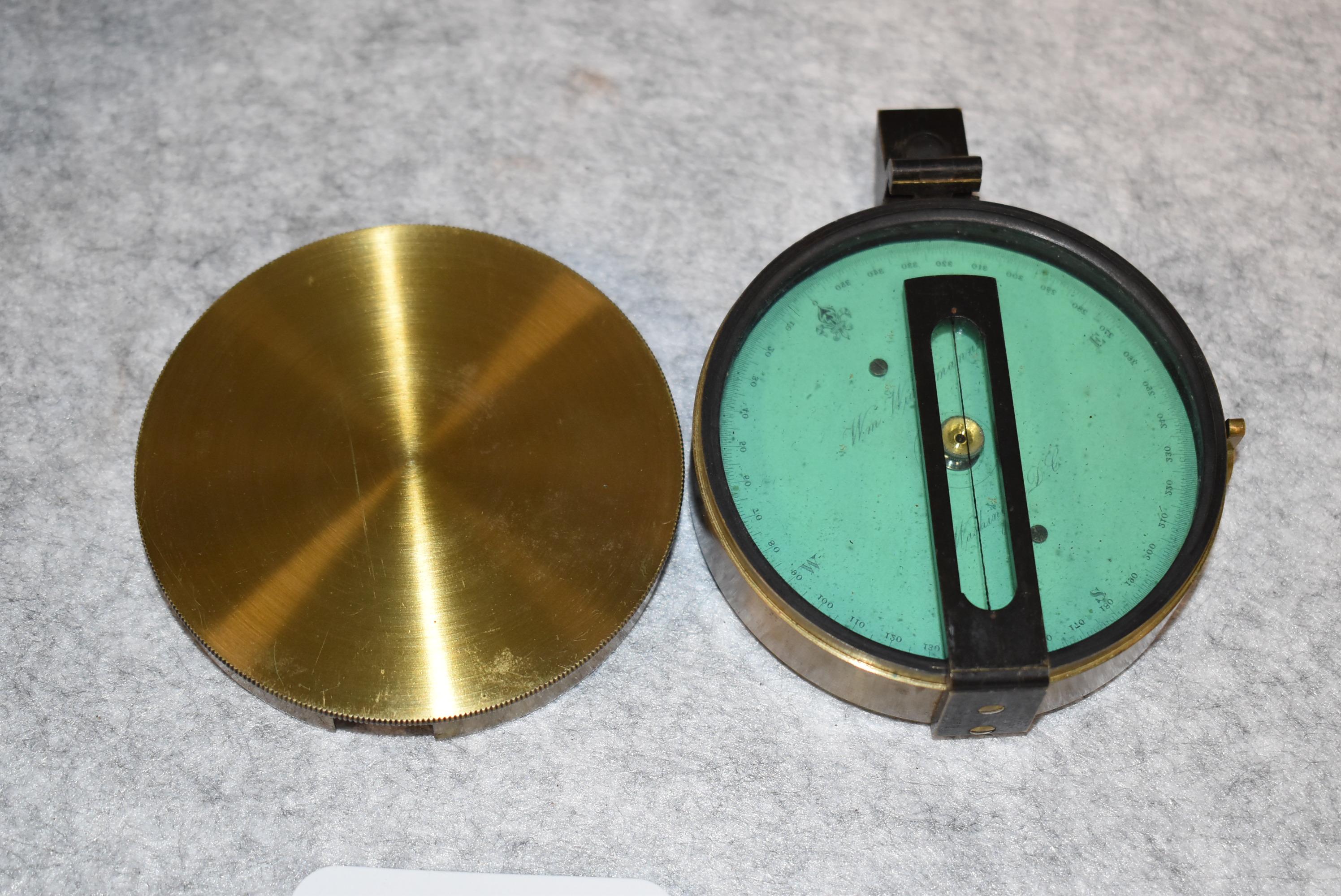 Brass compass in leather carrying case