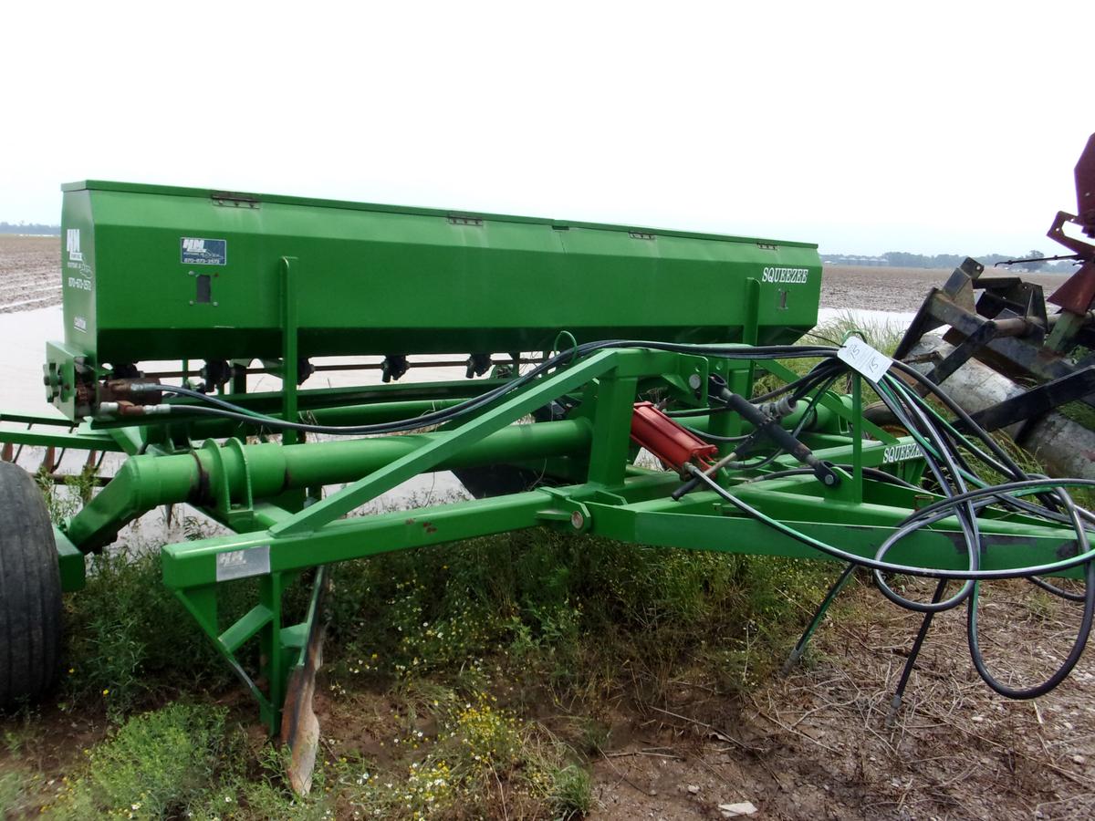 K-M Levee Squeezer w/walking tandems, seeder & disc filler