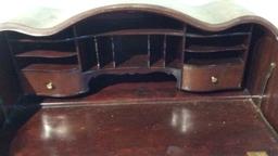 BREAKFRONT SERPENTINE WRITING DESK