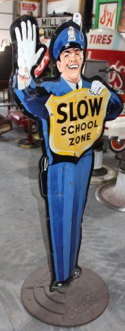 Slow school zone sign on front, Coca Cola advertisng on back side, on Coca
