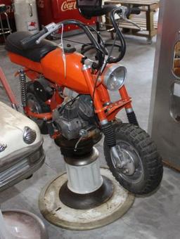 Mini bike on barber shop base