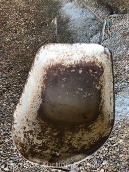 Old wooden handle wheel barrel