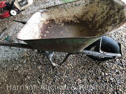 Old wooden handle wheel barrel