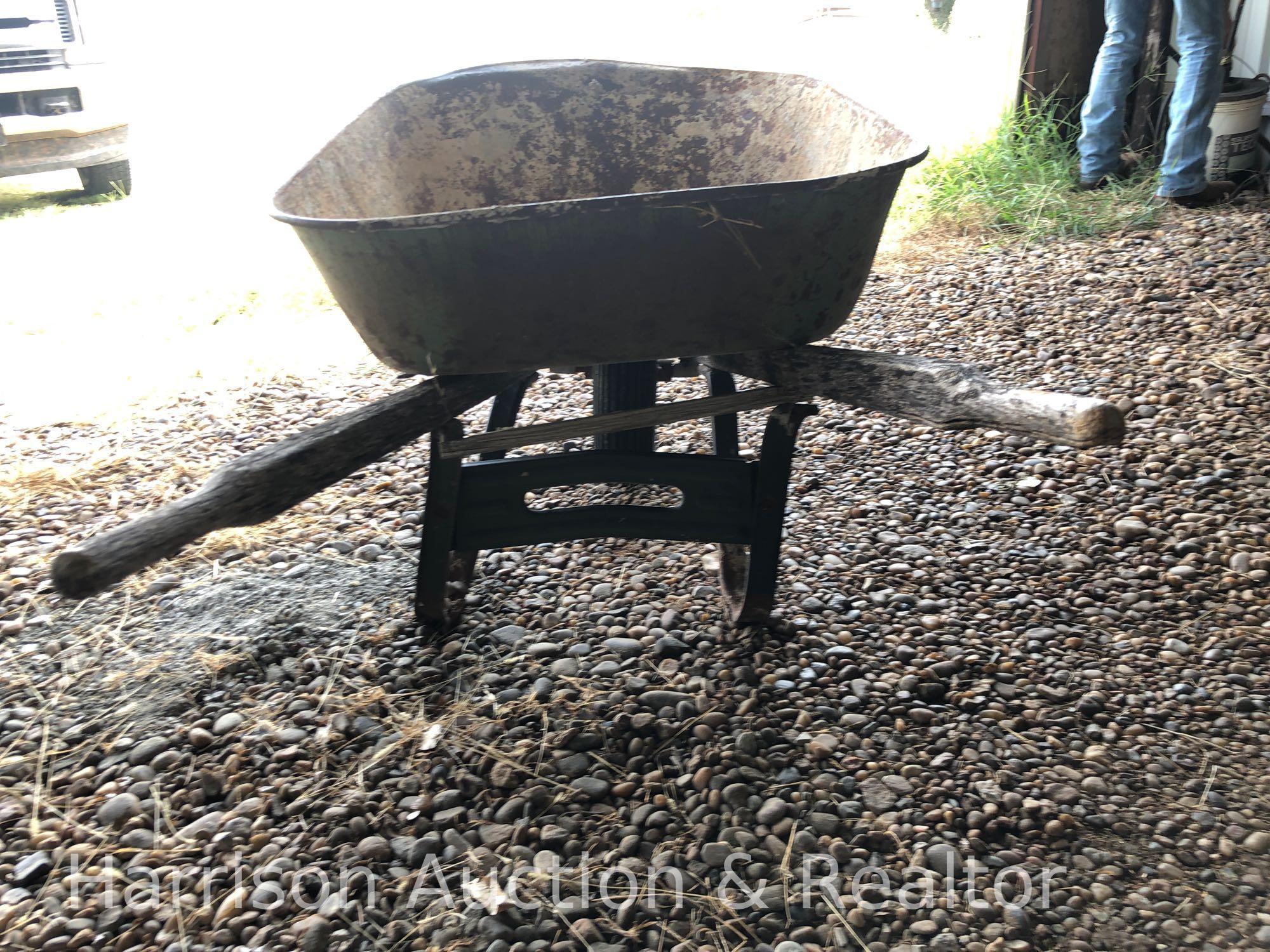 Old wooden handle wheel barrel