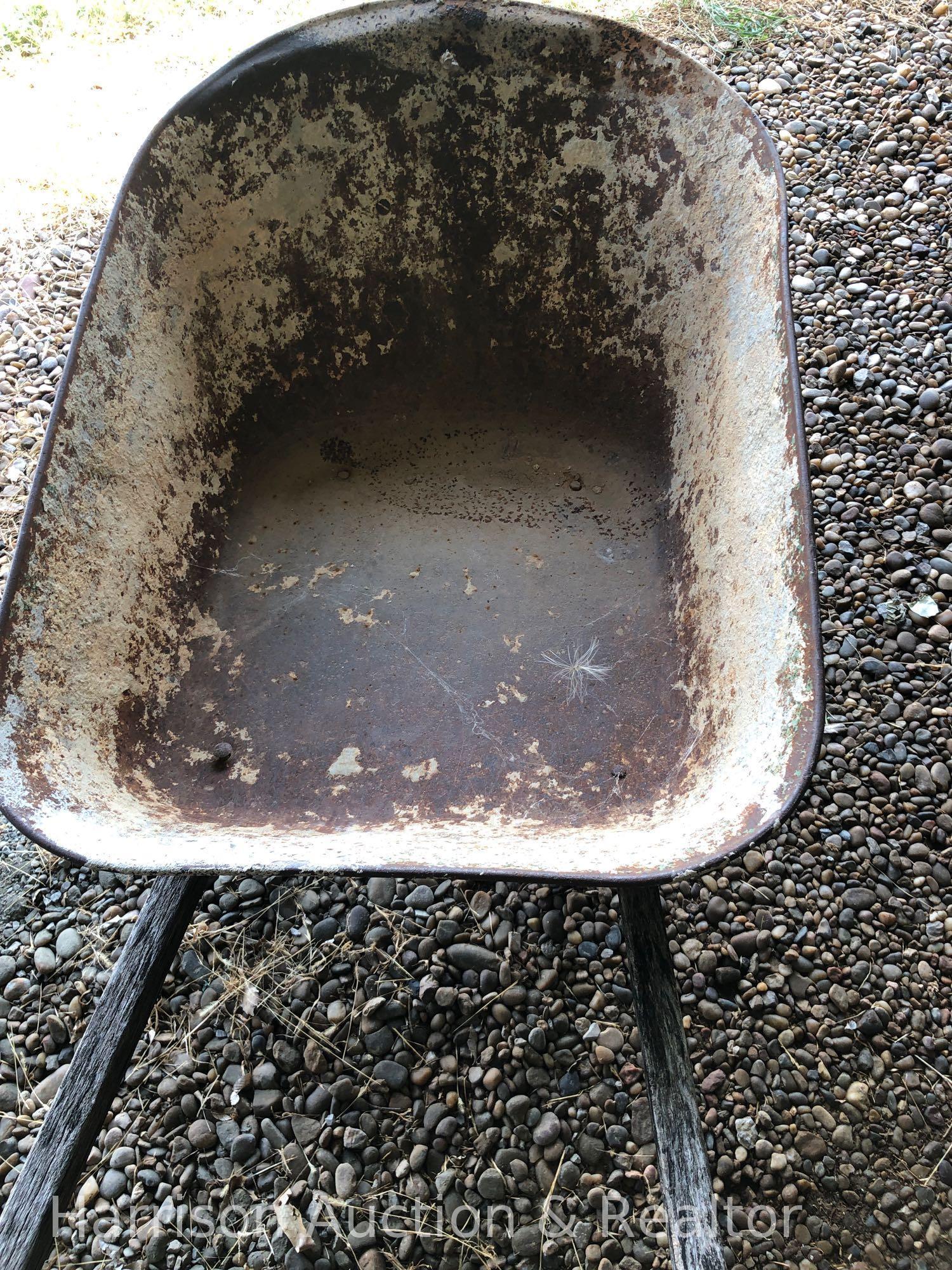 Old wooden handle wheel barrel
