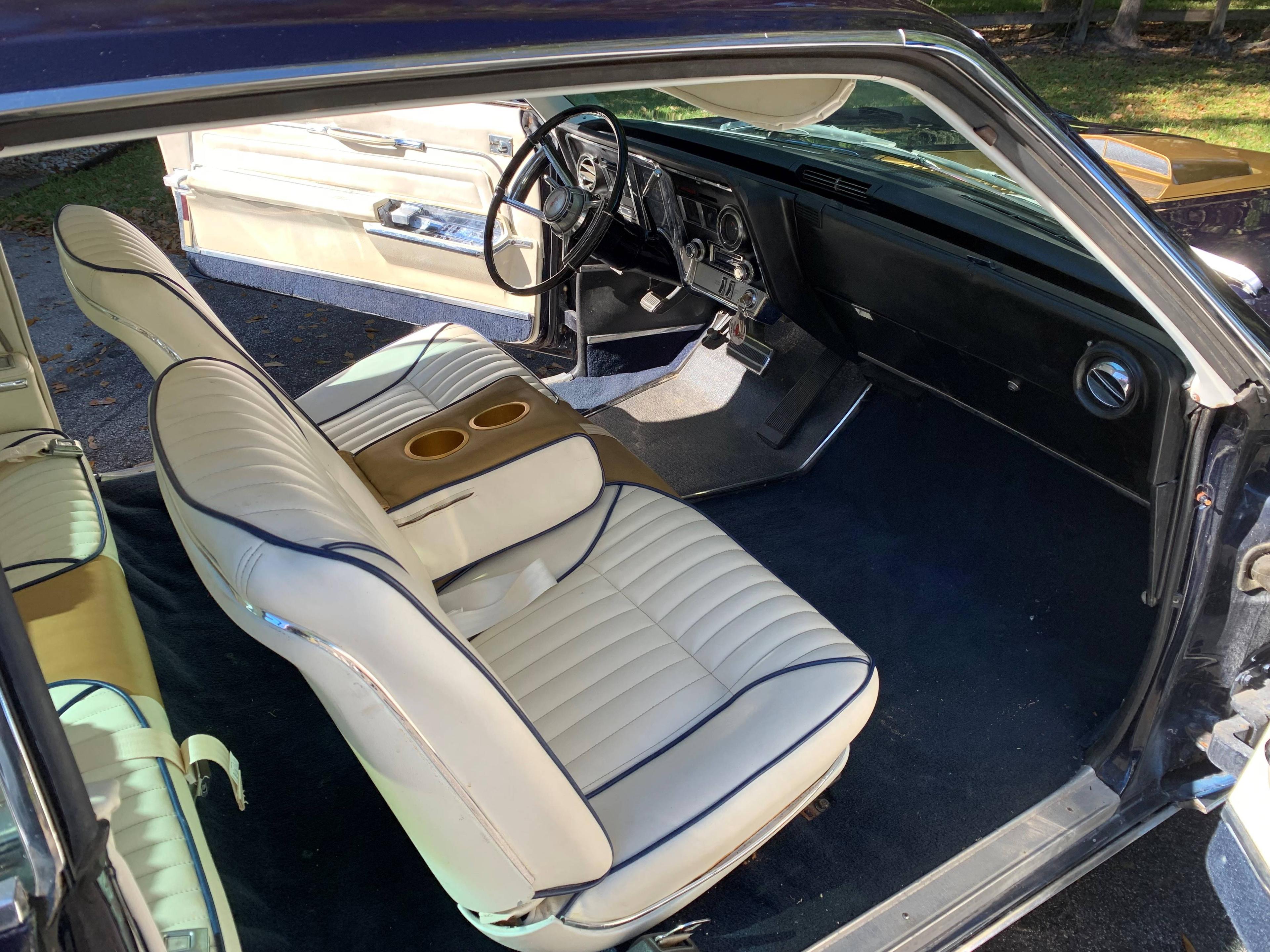 1966 Oldsmobile Toronado Coupe. Older restoration done to the theme of a Hu