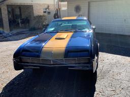 1966 Oldsmobile Toronado Coupe. Older restoration done to the theme of a Hu